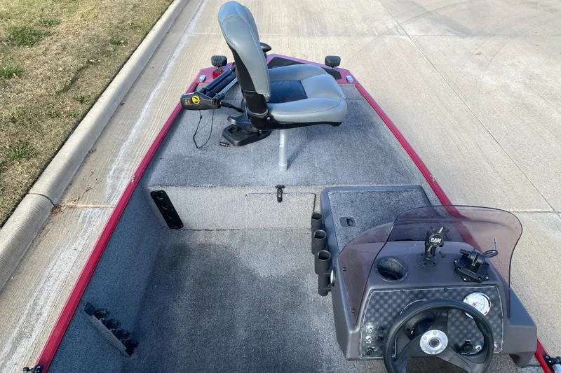 Slide: The Image of 2021 Tracker Bass Tracker Classic XL boat interior with steering console and seating. - 4