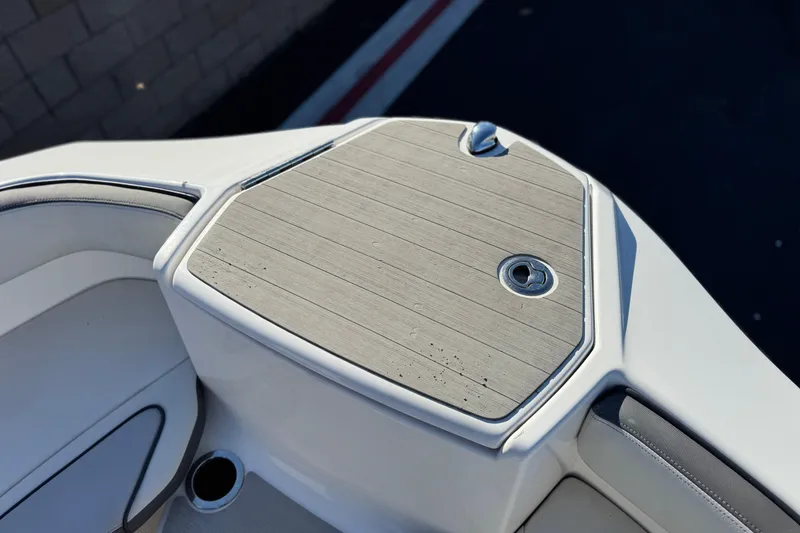 Slide: The Image of 2023 Yamaha Boats AR250 bow with sleek deck design and stainless steel fixtures. - 13