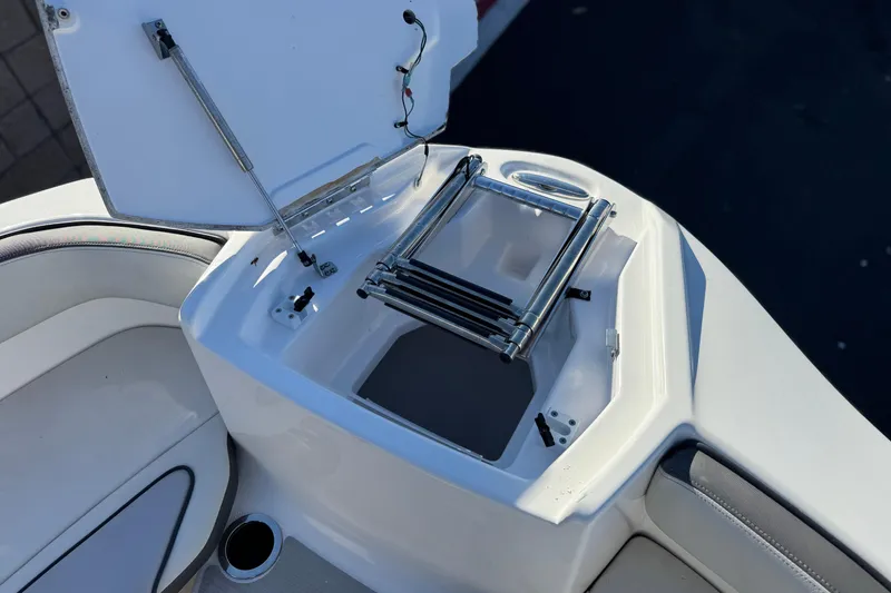 Slide: The Image of 2023 Yamaha AR250 boat with open storage compartment and ladder. - 14