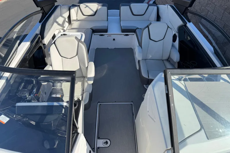 Slide: The Image of 2023 Yamaha Boats AR250 interior with modern seating and sleek design. - 16