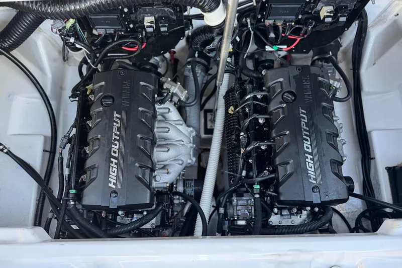 Slide: The Image of 2023 Yamaha AR250 boat engine compartment with dual high-output engines. - 19