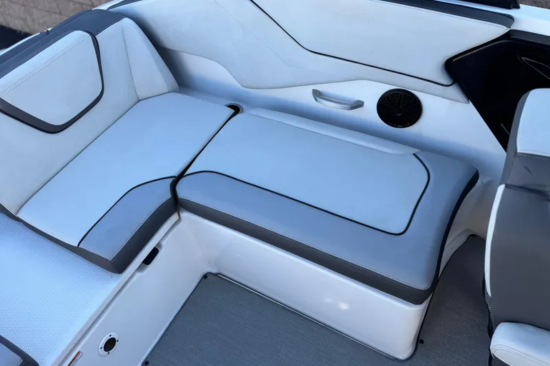 Slide: The Image of 2023 Yamaha Boats AR250 interior seating with sleek, modern design and comfortable upholstery. - 21
