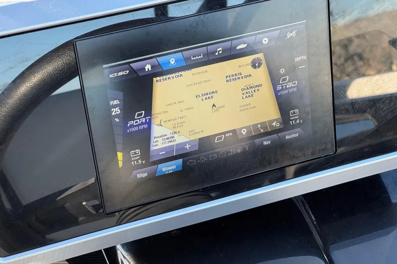 Slide: The Image of 2023 Yamaha Boats AR250 dashboard with navigation display showing map and boat metrics. - 28