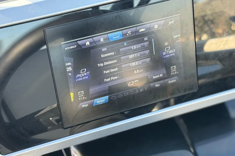 Slide: The Image of Dashboard display of 2023 Yamaha Boats AR250 showing fuel and trip data. - 29