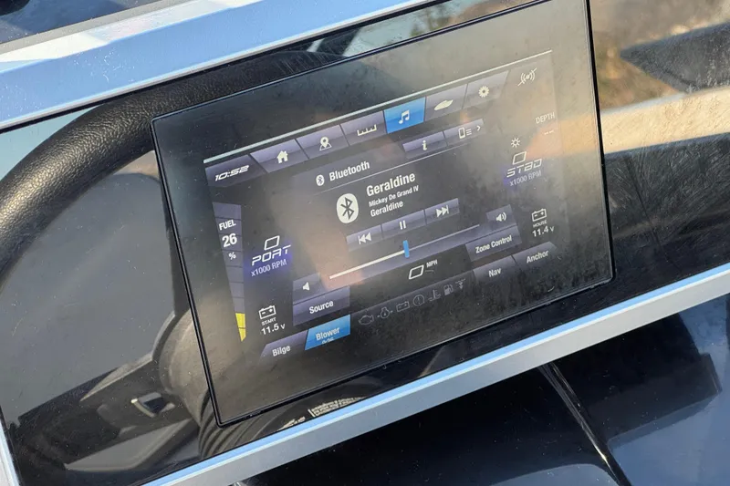 Slide: The Image of Dashboard display of 2023 Yamaha Boats AR250 showing Bluetooth music controls. - 30