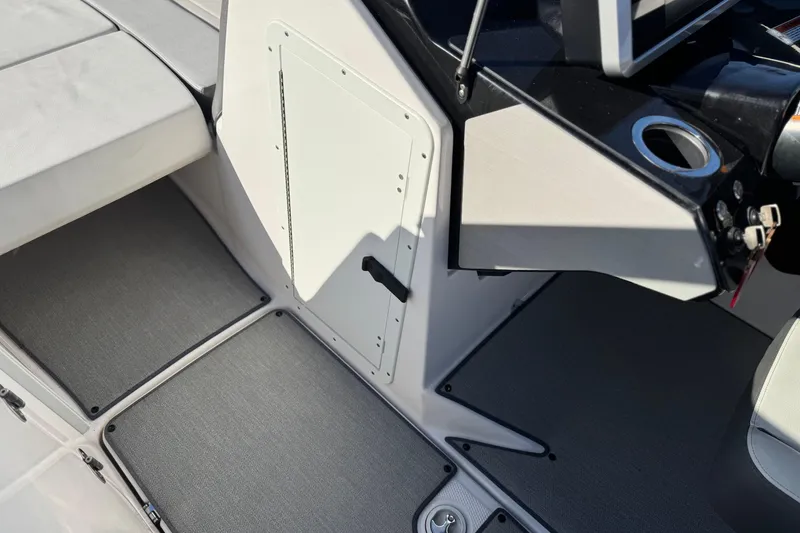 Slide: The Image of 2023 Yamaha Boats AR250 interior cockpit with seating and control panel. - 32