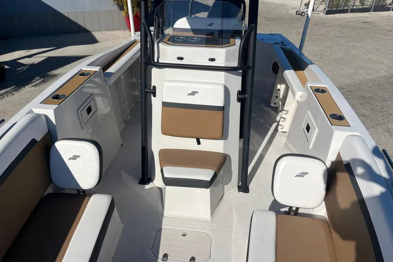 Slide: The Image of 2024 Starcraft SVX 231 OB CC boat interior with seating and console. - 13