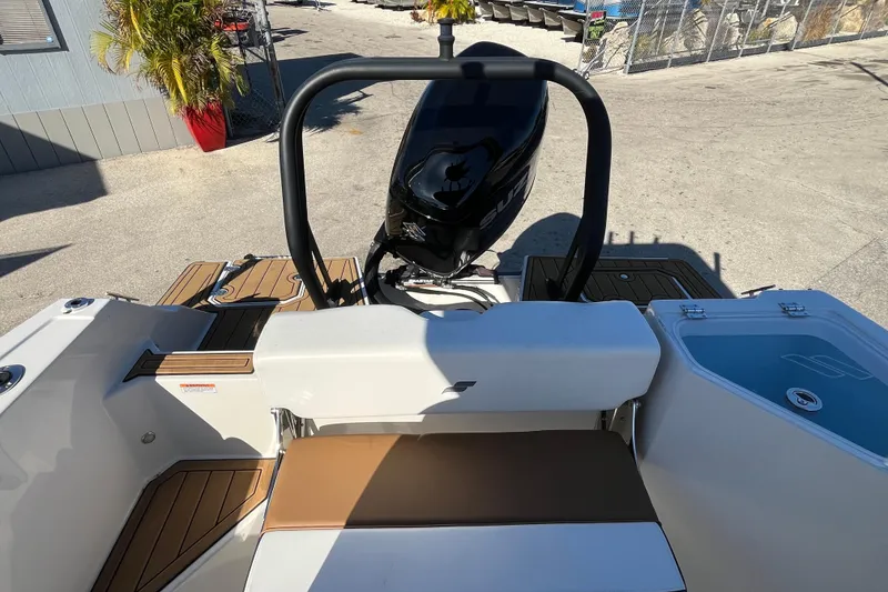 Slide: The Image of 2024 Starcraft SVX 231 OB CC boat with outboard motor and seating area. - 15