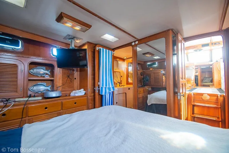 Slide: The Image of Interior of 1985 Spindrift 40 yacht with wooden cabinetry and modern amenities. - 15