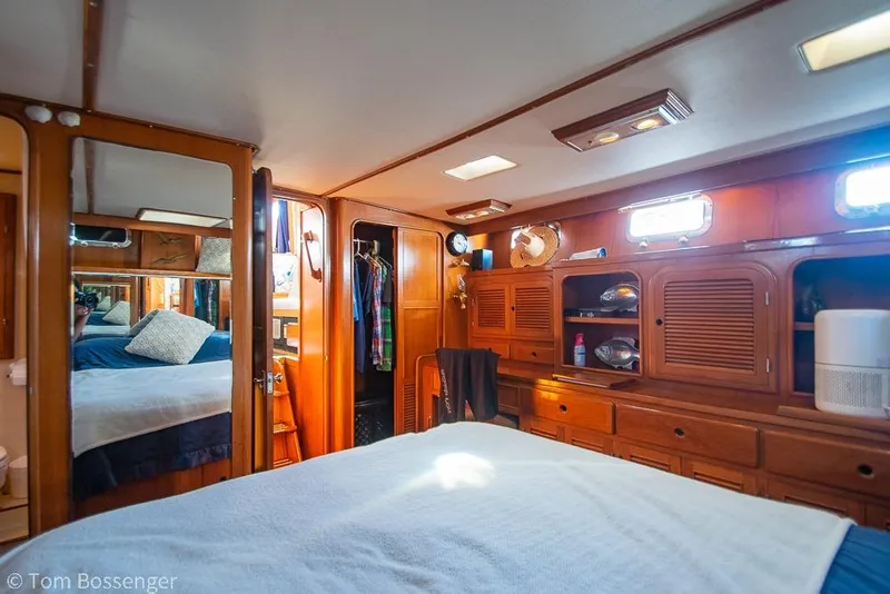 Slide: The Image of Luxurious cabin interior of 1985 Spindrift 40 yacht with wooden furnishings and cozy bedding. - 16