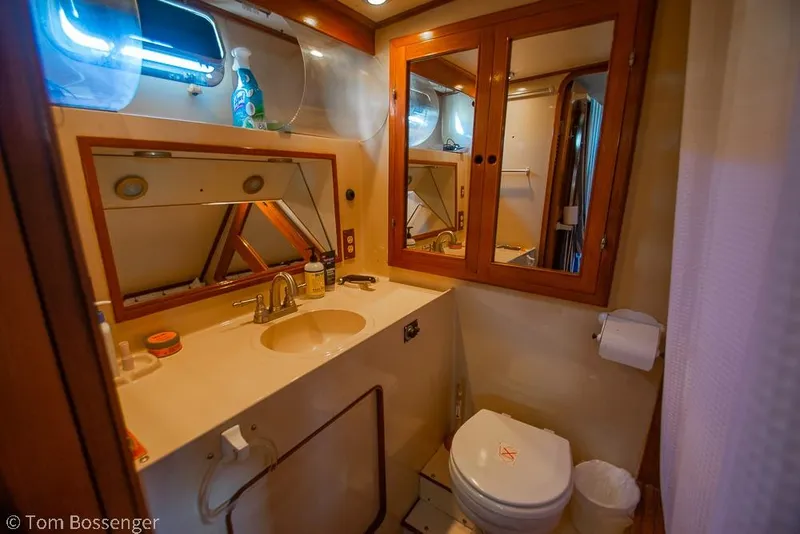 Slide: The Image of Bathroom interior of 1985 Spindrift 40 yacht with sink, mirror, and toilet. - 17