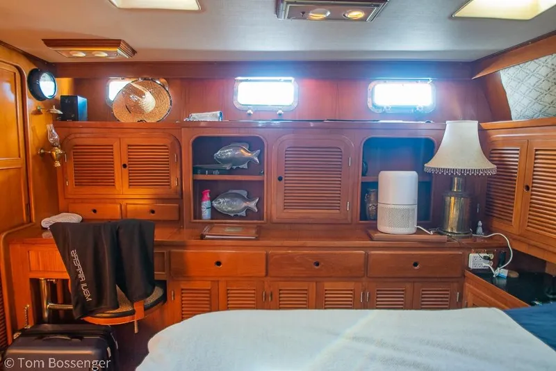 Slide: The Image of Interior of 1985 Spindrift 40 yacht with wooden cabinetry and decorative elements. - 19