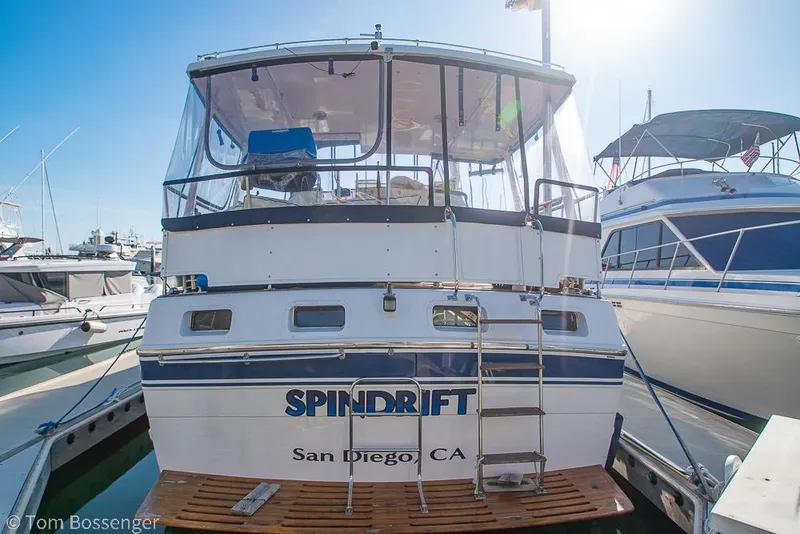Slide: The Image of 1985 Spindrift 40 yacht docked in San Diego marina, rear view with ladder. - 2