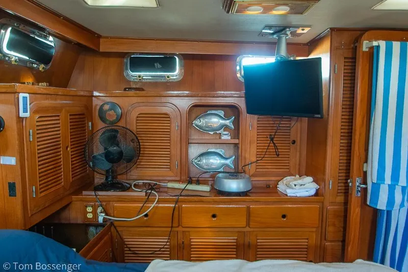 Slide: The Image of Interior of 1985 Spindrift 40 yacht with wooden cabinets, fan, and mounted TV. - 20