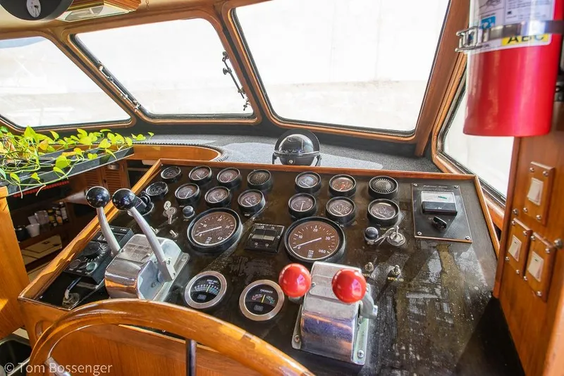 Slide: The Image of Control panel of a 1985 Spindrift 40 boat with gauges and levers. - 23