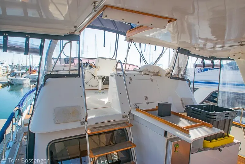 Slide: The Image of 1985 Spindrift 40 yacht interior with helm, docked at marina. - 28