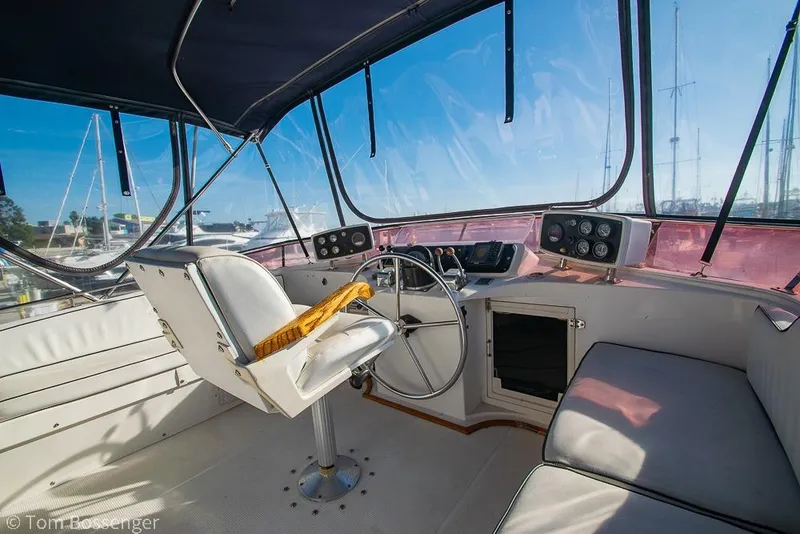 Slide: The Image of Interior view of 1985 Spindrift 40 yacht cockpit with steering wheel and seating. - 30