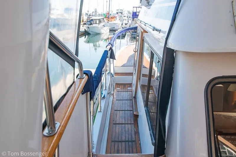 Slide: The Image of Side deck view of a 1985 Spindrift 40 yacht in a marina. - 34