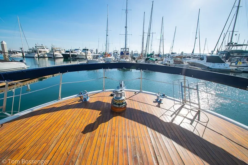 Slide: The Image of Deck view of 1985 Spindrift 40 yacht in a marina, surrounded by sailboats. - 38