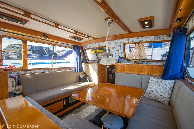 Slide: The Image of Interior of 1985 Spindrift 40 yacht with cozy seating and wooden table. - 5