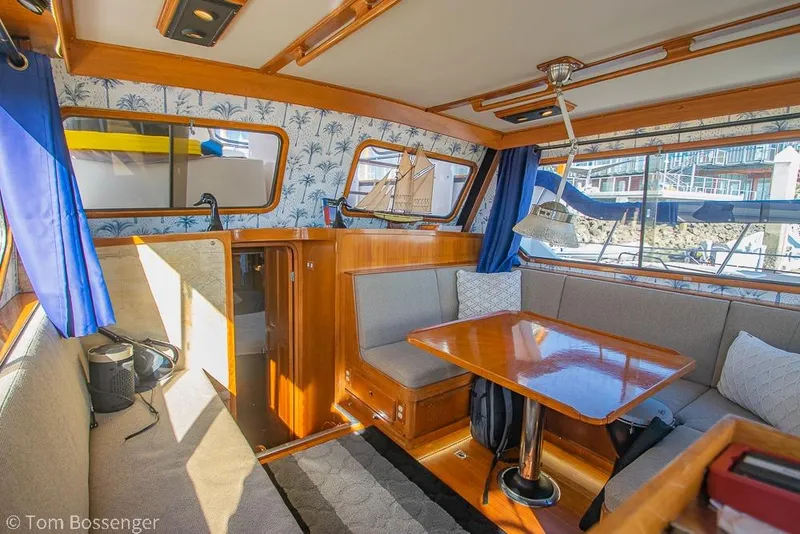 Slide: The Image of Interior of 1985 Spindrift 40 yacht with cozy seating and wooden table. - 6
