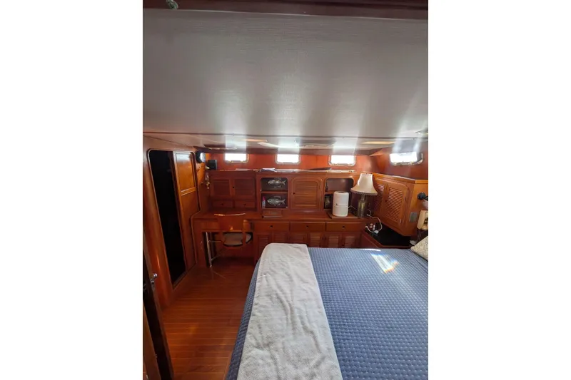 Slide: The Image of Cozy cabin interior of 1985 Kha Shing Spindrift 40 yacht with wooden furnishings. - 20