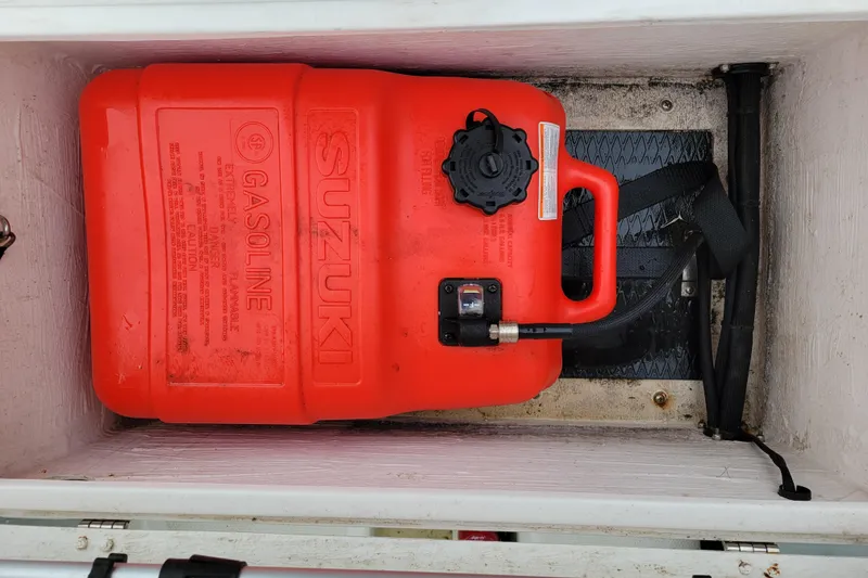 Slide: The Image of Red Suzuki gasoline tank in 2020 Inmar 330R-YS boat compartment. - 10