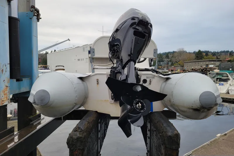 Slide: The Image of 2020 Inmar 330R-YS inflatable boat with outboard motor on dock. - 13