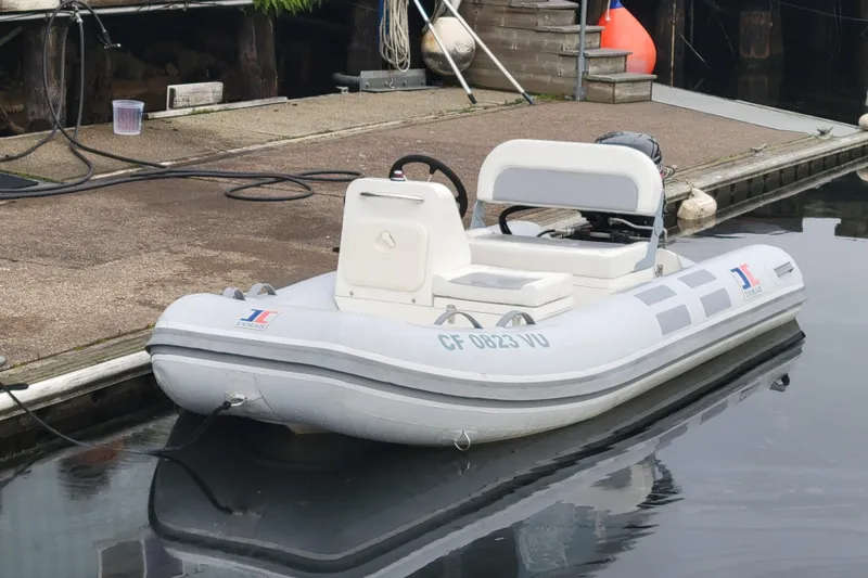 Slide: The Image of 2020 Inmar 330R-YS inflatable boat docked at a marina. - 4