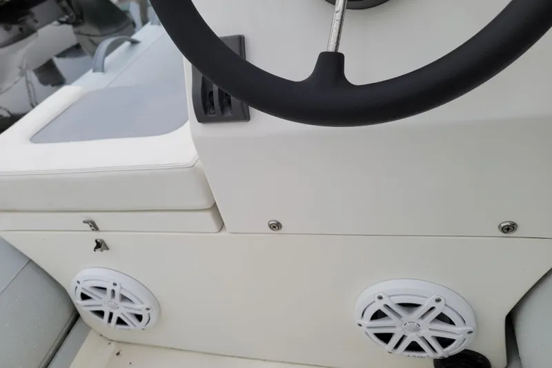 Slide: The Image of 2020 Inmar 330R-YS boat interior with steering wheel and speakers. - 7