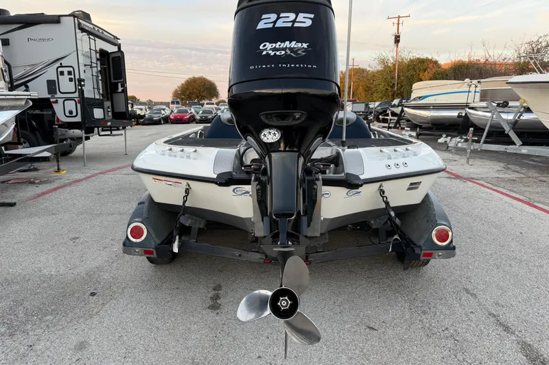 Slide: The Image of Mercury Pro XS engine on 2007 Ranger Z19 Comanche boat by a lakeside. - 10