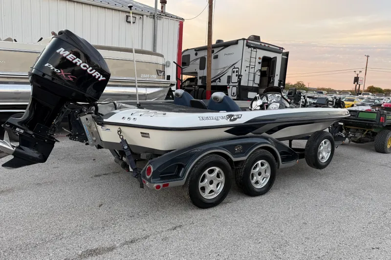 Slide: The Image of 2007 Ranger Z19 Comanche boat propeller on a concrete surface. - 12