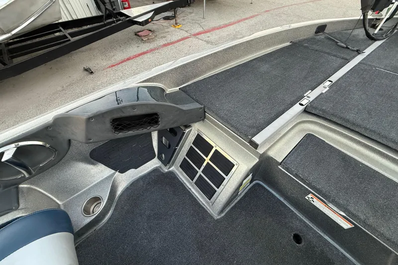 Slide: The Image of 2007 Ranger Z19 Comanche boat on trailer by a lake, overcast sky. - 18