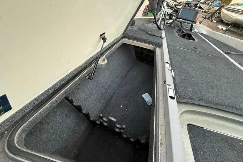 Slide: The Image of 2007 Ranger Z19 Comanche boat on trailer by a lake under cloudy skies. - 19