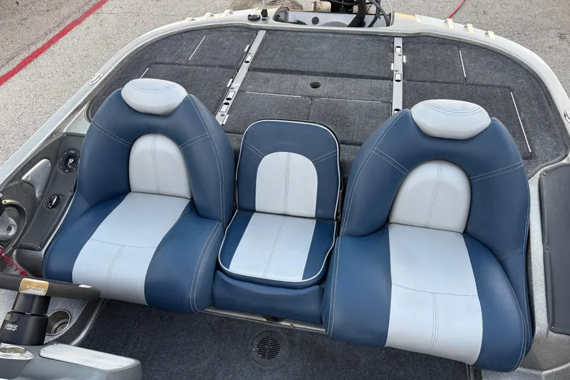 Slide: The Image of 2007 Ranger Z19 Comanche boat on a lakeside dock under cloudy skies. - 23