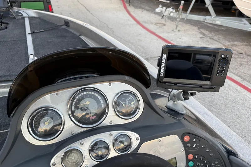 Slide: The Image of 2007 Ranger Z19 Comanche bass boat on trailer in parking lot. - 25