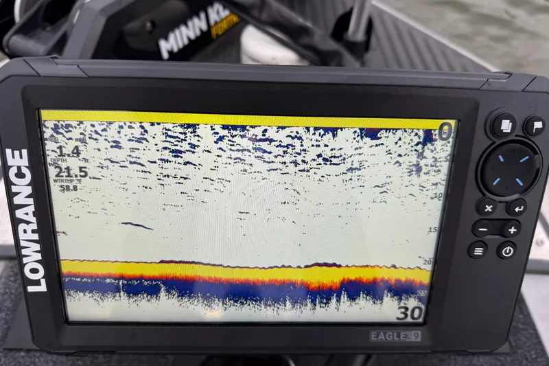 Slide: The Image of Fishfinder display on a 2007 Ranger Z19 Comanche boat, showing depth and water temperature. - 30