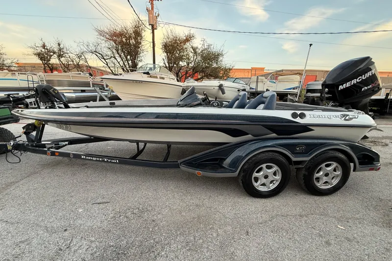 Slide: The Image of 2007 Ranger Z19 Comanche boat on trailer by lakeside dock. - 4