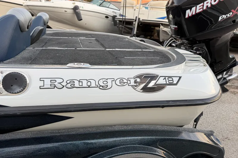 Slide: The Image of 2007 Ranger Z19 Comanche boat with Mercury Pro XS engine on trailer by lake. - 7