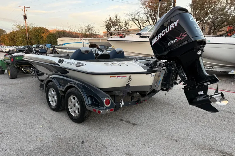 Slide: The Image of 2007 Ranger Z19 Comanche boat with Mercury Pro XS engine on trailer near water. - 8