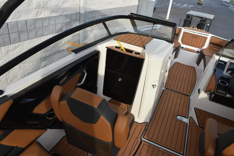 Slide: The Image of 2026 Yamaha Boats 252SD interior with brown seating and sleek design. - 10