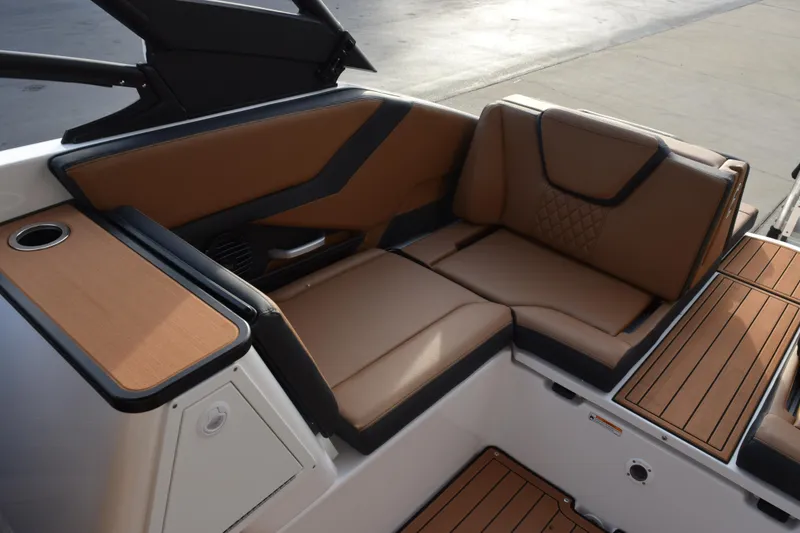 Slide: The Image of 2026 Yamaha Boats 252SD interior with luxurious brown seating and sleek design. - 12