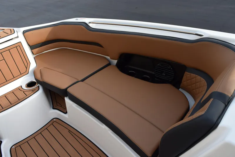 Slide: The Image of Luxurious seating area on 2026 Yamaha Boats 252SD with tan and black upholstery. - 14
