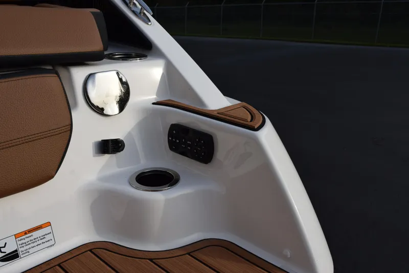 Slide: The Image of 2026 Yamaha Boats 252SD interior detail with cup holder and control panel. - 7
