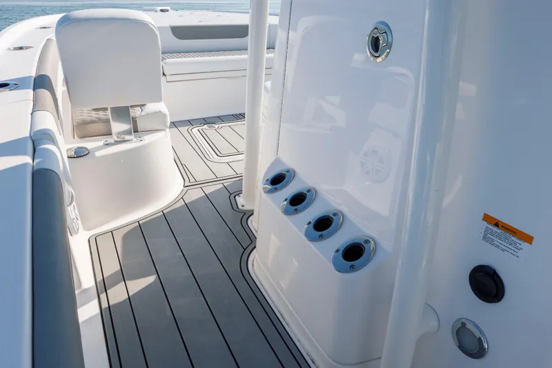 Slide: The Image of 2024 Caymas 26 HB boat interior with sleek seating and rod holders. - 19
