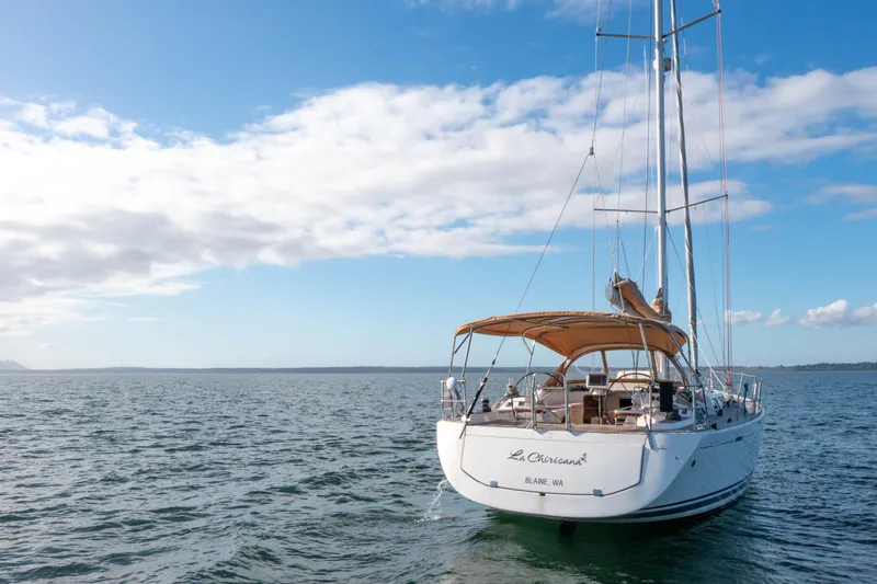 Slide: The Image of Sailing yacht Dufour 525 Grand Large 2011 on open water under blue sky. - 12
