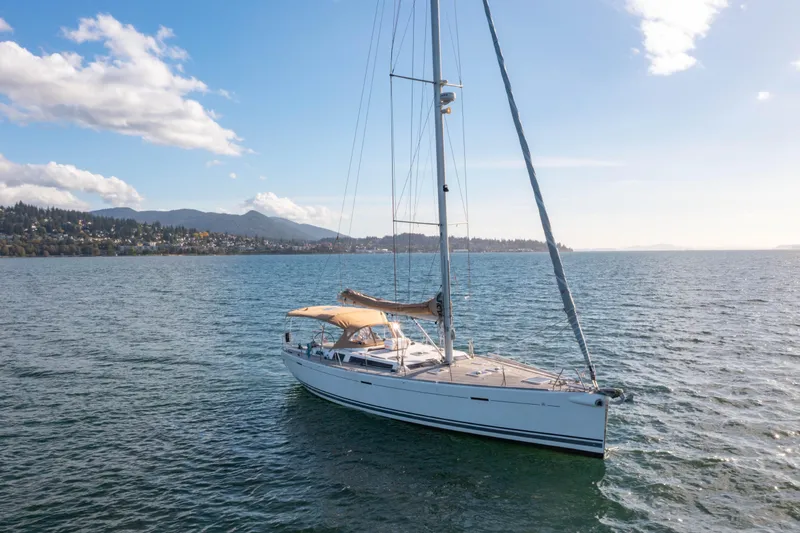 Slide: The Image of Sailing yacht Dufour 525 Grand Large 2011 on serene waters under a clear sky. - 14