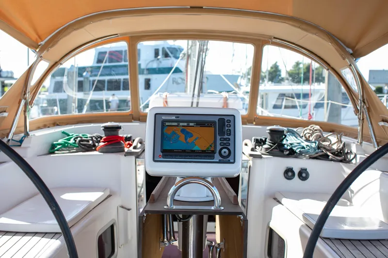 Slide: The Image of Cockpit of 2011 Dufour 525 Grand Large sailboat with navigation system and ropes. - 22
