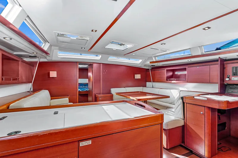Slide: The Image of Luxurious interior of 2011 Dufour 525 Grand Large yacht with elegant wood finish and skylights. - 23