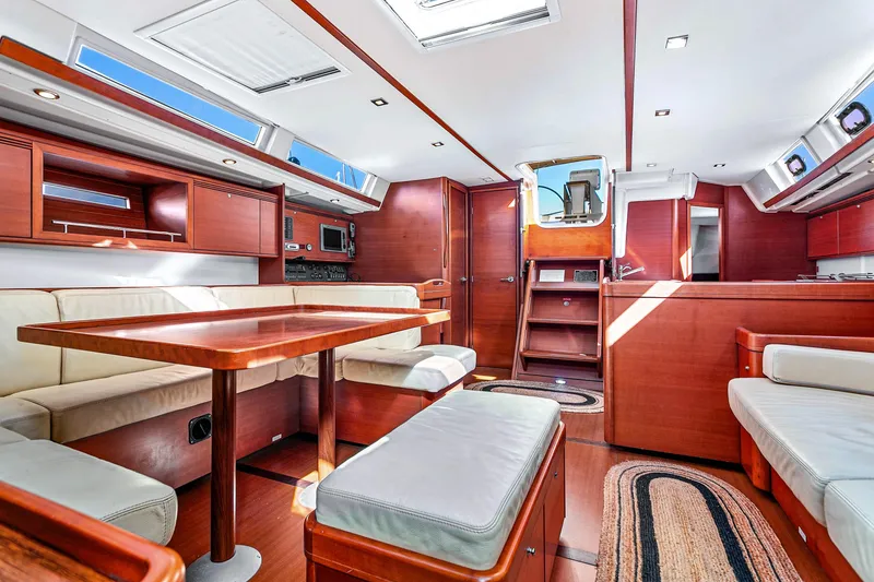 Slide: The Image of Luxurious interior of 2011 Dufour 525 Grand Large yacht with elegant wood finish. - 32